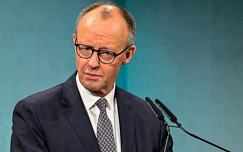 German Chancellor Friedrich Merz delivers the opening speech at an economic summit hosted by German newspaper Süddeutsche Zeitung at the Adlon Hotel in Berlin on November 17, 2025.
