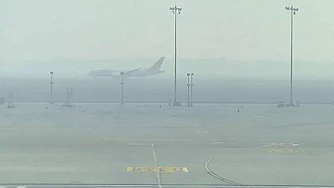 air pollution with heavy fog impacting flight operations in delhi