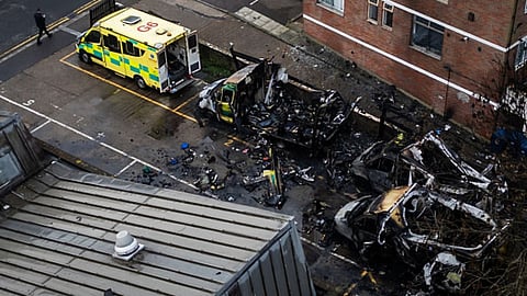 An aerial view of firefighters continuing to monitor the scene after four Hatzola ambulances burned overnight near the Maksaik Hadath Synagogue in the Golders Green area of ​​London, England, on March 23, 2026.