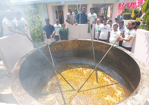 Devotees prepare 3,700 kg khichdi in a huge pan as an offering to Shridi Saibaba in an attempt to set a Guinness World Record at Saibaba temple in Awadhpuri locality in Bhopal on Thursday.