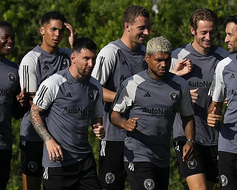 Lionel Messi jogged a lap with his new teammates