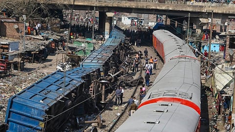 Restoration work underway after a goods train derailed near Zakhira in New Delhi.