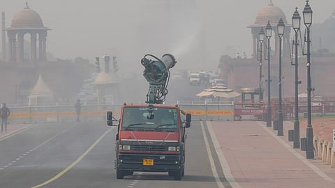 An anti-smog gun sprays mist to mitigate smoggy conditions, in New Delhi, Tuesday, Nov. 19, 2024.