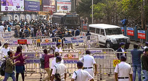 Police personnel keep vigil as Sanjay Roy, accused in the alleged rape and murder of an on-duty doctor at R G Kar Medical College and Hospital, is brought to the Sealdah court in police vehicle on the day of the verdict, in Kolkata, Saturday, Jan. 18, 2025.