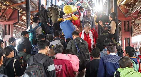 Passengers in a large number at the New Delhi railway station, Sunday, Feb. 16, 2025.