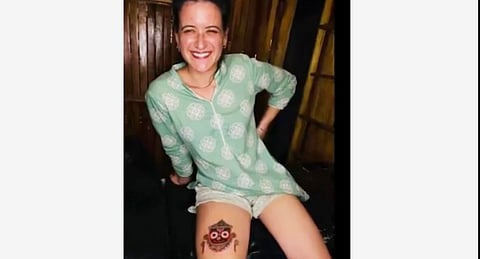 Lord Jagannath tattoo on foreign woman's thigh