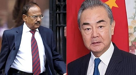 Chinese Foreign Minister Wang (R) speaks to NSA Doval (L)