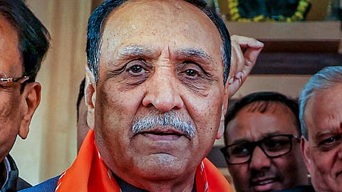 file image former Gujarat Chief Minister Vijay Rupani being welcomed by Rajasthan BJP President Madan Rathore as he arrives for a meeting at BJP office in Jaipur. 