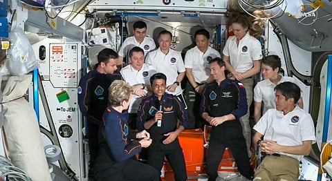 In this screengrab from @NASA via Youtube on June 26, 2025, India's Shubhanshu Shukla with three other astronauts and International Space Station (ISS) crew after the Axiom-4 mission's Space-X Dragon spacecraft docked to the ISS, as part of the mission.