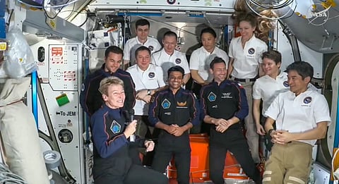 In this screengrab from @NASA via Youtube on June 26, 2025, India's Shubhanshu Shukla with three other astronauts and International Space Station (ISS) crew after the Axiom-4 mission's Space-X Dragon spacecraft docked to the ISS, as part of the mission.
