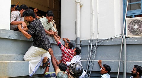 Members of Students' Federation of India (SFI) try to enter the Kerala University office during a protest against Kerala Governor Rajendra Arlekar, alleging saffronisation of state universities, in Thiruvananthapuram, Tuesday, July 8, 2025.