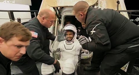 In this screengrab from a video posted by @Axiom_Space on July 15, 2025, Axiom-4 mission crew member and astronaut Shubhanshu Shukla greets as he reaches Earth with other crew members of the mission aboard the Dragon spacecraft that splashed down off California.