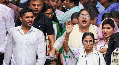 West Bengal Chief Minister and TMC chief Mamata Banerjee along with party National General Secretary Abhishek Banerjee and other leaders participates in a protest march against the alleged harassment of Bengali-speaking people in BJP-ruled states, in Kolkata, West Bengal, Wednesday, July 16, 2025.