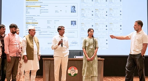 Leader of Opposition in the Lok Sabha and Congress leader Rahul Gandhi presents people as evidence during a press conference, in New Delhi, Thursday, Sept. 18, 2025.