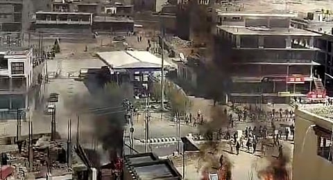 Smoke billows out from a structure set ablaze by miscreants amid a massive protest and shutdown, in Leh, Ladakh, September 24, 2025.