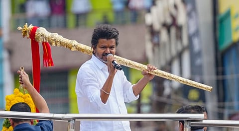 Tamilaga Vettri Kazhagam (TVK) chief and actor Vijay greets supporters during a rally, in Namakkal, Tamil Nadu, Saturday, Sept. 27, 2025.