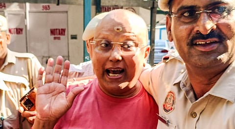 Self-styled godman Chaitanyananda Saraswati, who allegedly sexually harassed 17 women students at a private institute in Agra, being produced at the Patiala House Court, in New Delhi, Sunday, Sept. 28, 2025.