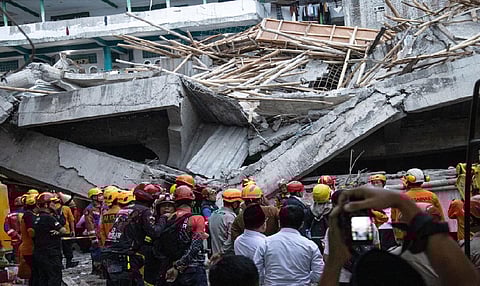 Indonesian rescuers search for missing students after school collapse kills 49 