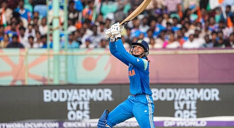 India's Smriti Mandhana plays a shot during the ICC Women's World Cup ODI cricket match between India Women and Australia Women, at the ACA-VDCA International Cricket Stadium, in Visakhapatnam, Sunday, Oct. 12, 2025.