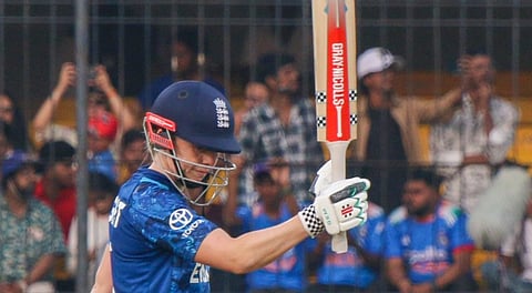 England's Heather Knight celebrates her half century during the ICC Women's World Cup ODI cricket match between India Women and England Women, at the Holkar Cricket Stadium, in Indore, Madhya Pradesh, Sunday, Oct. 19, 2025.