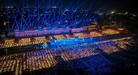 an aerial view of 'diyas', earthen lamps, lit during the 'Deepotsav' celebration on the eve of the 'Diwali' festival, at Ram Ki Paidi on the banks of the Saryu river, in Ayodhya.