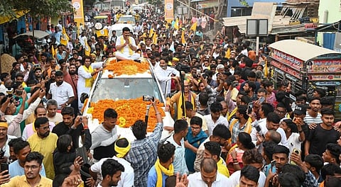 Jan Suraaj Party chief Prashant Kishor with others during an campaign roadshow for the upcoming Bihar Assembly elections, in Saran district, Wednesday, Oct. 22, 2025.