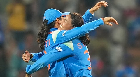 India's Sneh Rana and Smriti Mandhana celebrate the wicket of New Zealand�s Amelia Kerr during an ICC Women's World Cup ODI cricket match between India Women and New Zealand Women, at the DY Patil Stadium, in Navi Mumbai, Thursday, Oct. 23, 2025.