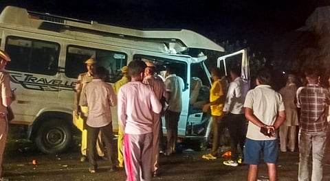 People gather around wreckage of a minibus after an accident, in Phalodi district, Rajasthan, Sunday, Nov. 2, 2025.