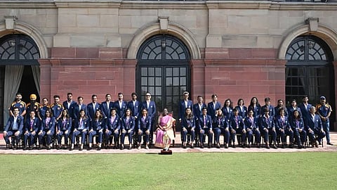 President lauds world champion women's team; presented with signed jersey