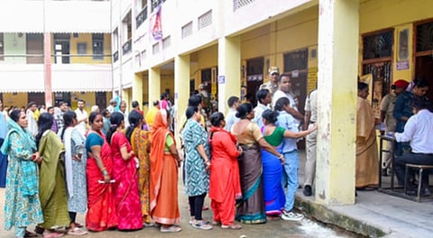 People line up to vote for Bihar assembly elections in second phase.