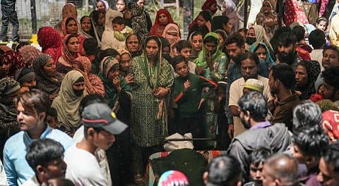 Family members and relatives of the e-rickshaw driver Jumman, who was killed in the blast near Red Fort, mourn after his mortal remains were brought to his residence, in New Delhi, Tuesday, Nov. 11, 2025. 