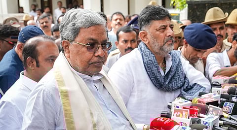 Siddaramaiah and Shivakumar jointly address the media after their meeting.