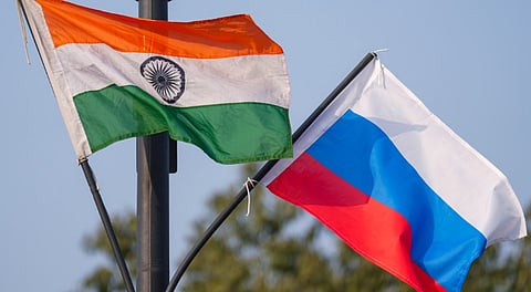 The Indian national flag and the Russian flag flutter on lamp posts along Kartavya Path ahead of Russian President Vladimir Putin's visit to India, in New Delhi, Thursday, Dec. 4, 2025. 