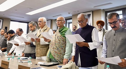 Congress leaders Shashi Tharoor, Salman Khurshid, Abhishek Singhvi, Digvijaya Singh and others take an oath during the Congress Working Committee (CWC) meeting on Dec. 27, 2025, at Indira Bhawan, in New Delhi.