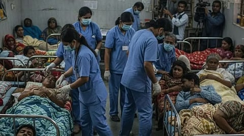 People receiving medical treatment at a hospital following water contamination in Indore.