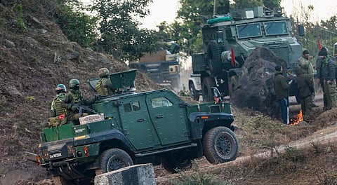 Security personnel patrol an area during a joint cordon and search operation conducted by the Special Operations Group (SOG) of J-K Police and other security forces to track down terrorists hiding in a forest, in Kathua district, Jammu and Kashmir, Thursday, Jan. 8, 2026.