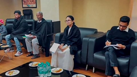 West Bengal Chief Minister Mamata Banerjee along with TMC MP Abhishek Banerjee and some SIR-affected families at the Election Commission office, in New Delhi.