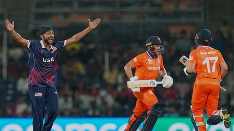 USA's Harmeet Singh, left, appeals successfully for the wicket of Netherlands' Roelof van der Merwe, centre, during an ICC Men's T20 World Cup 2026 cricket match between Netherlands and USA, at MA Chidambaram Stadium, in Chennai, Tamil Nadu, Friday, Feb. 13, 2026. 