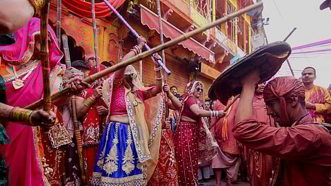 Barsana: People take part in the Lathmar Holi festival celebrations, in Barsana, Mathura, Wednesday, Feb. 25, 2026.