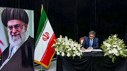 Foreign Secretary Vikram Misri signs the condolence book at the the Embassy of Iran, after the recent killing of Iranian Supreme Leader Ayatollah Ali Khamenei, in New Delhi. 