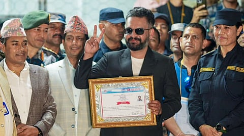 Balendra Shah, candidate of the Rastriya Swatantra Party (RSP) from Jhapa Constituency-5, shows a certificate at the Election Commission premises after winning the constituency in the Nepal general elections, in Jhapa, Nepal, Saturday, March 7, 2026.