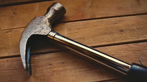 Man attacks neighbour with hammer for sending personal message to wife