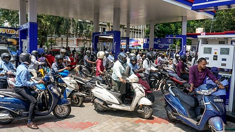Motorists queue up to refuel their two-wheelers at a petrol bunk amid shortage of petrol and diesel, in Chennai, Thursday, March 12, 2026.