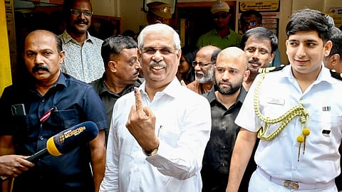 Kerala Governor Rajendra Vishwanath Arlekar showing a mark of indelible ink after casting his vote at a polling booth during the Kerala Assembly Election 2026, in Kerala.