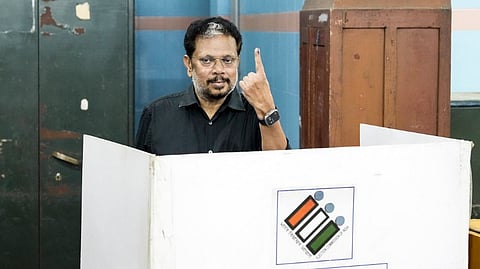 Puducherry Lt. Governor Kuniyil Kailashnathan shows his ink-marked finger after casting vote during the Puducherry Assembly elections, at a polling station in Puducherry, Thursday, April 9, 2026.