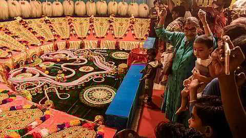 People attend the 'Paramekkavu chamayam', an ornament exhibition which showcases the ornaments going to be used in the 'Thrissur Pooram' festival, in Thrissur, Kerala, Saturday, April 25, 2026.