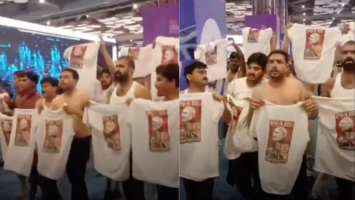 Young Congress workers protest shirtless at the AI Summit in New Delhi.