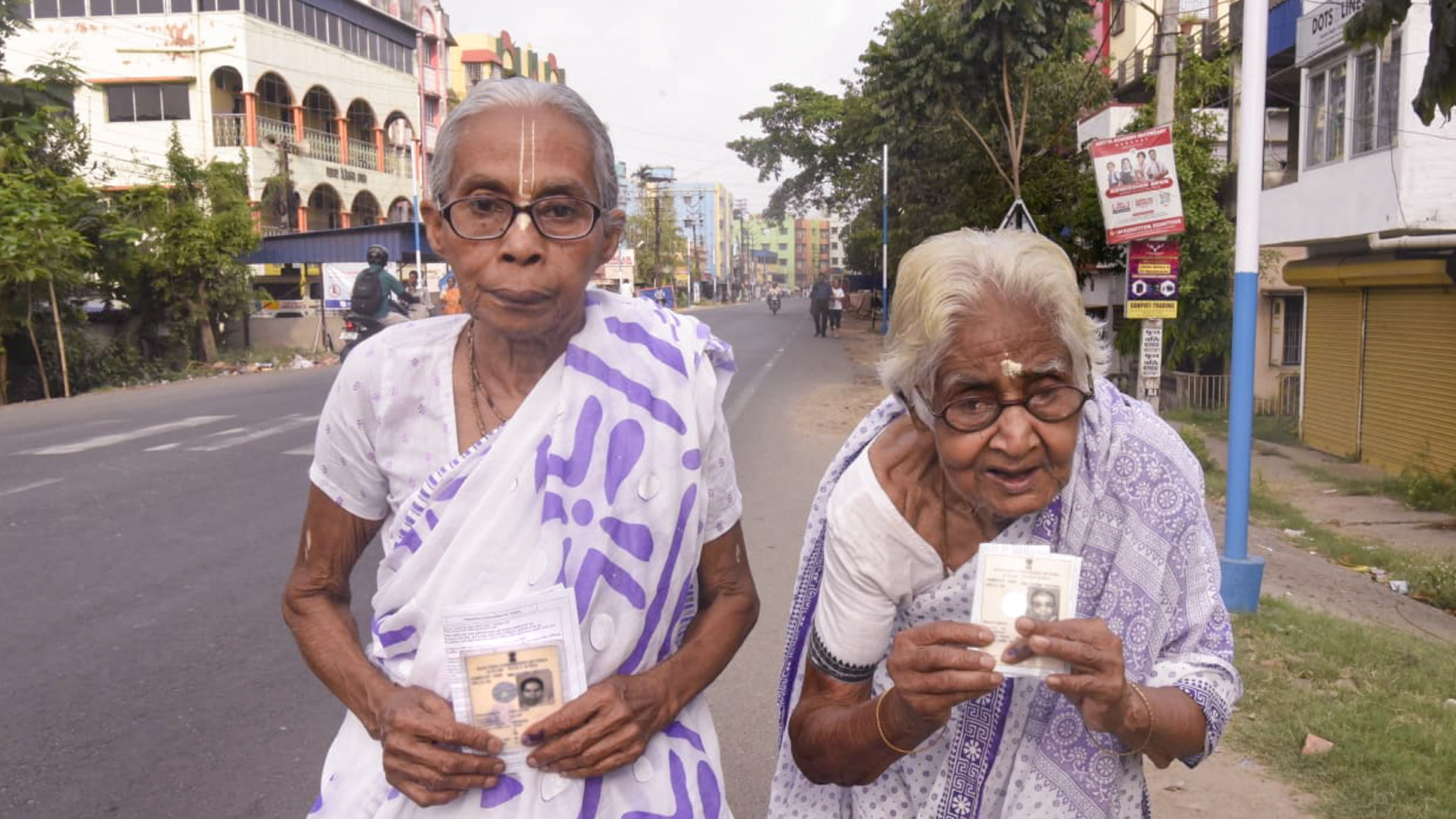 Elderly women show their credentials after casting vote during the West Bengal Assembly elections, in North 24 Parganas district, Wednesday, April 29, 2026.