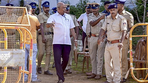 Congress candidate T.D. Raje Gowda, centre, interacts with police personnel amid verification of postal ballots polled for Sringeri Assembly constituency during the elections in April-May 2023, as per instructions of the High Court of Karnataka, in Chikkamagaluru, Karnataka, Saturday, May 2, 2026.