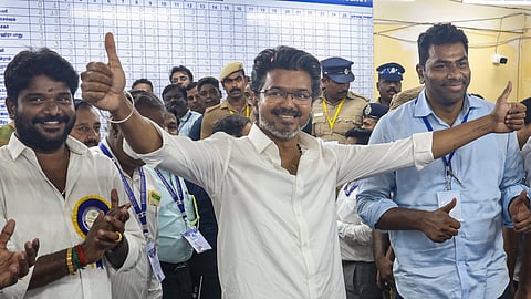 Tamilaga Vettri Kazhagam (TVK) chief and candidate from the Perambur constituency, Vijay, celebrates after winning in the Tamil Nadu Assembly elections results, in Chennai, Monday, May 4, 2026. 
